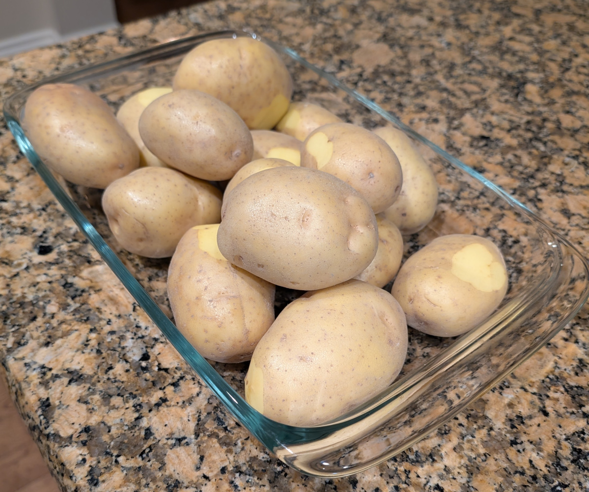 Potatoes filling a casserole dish