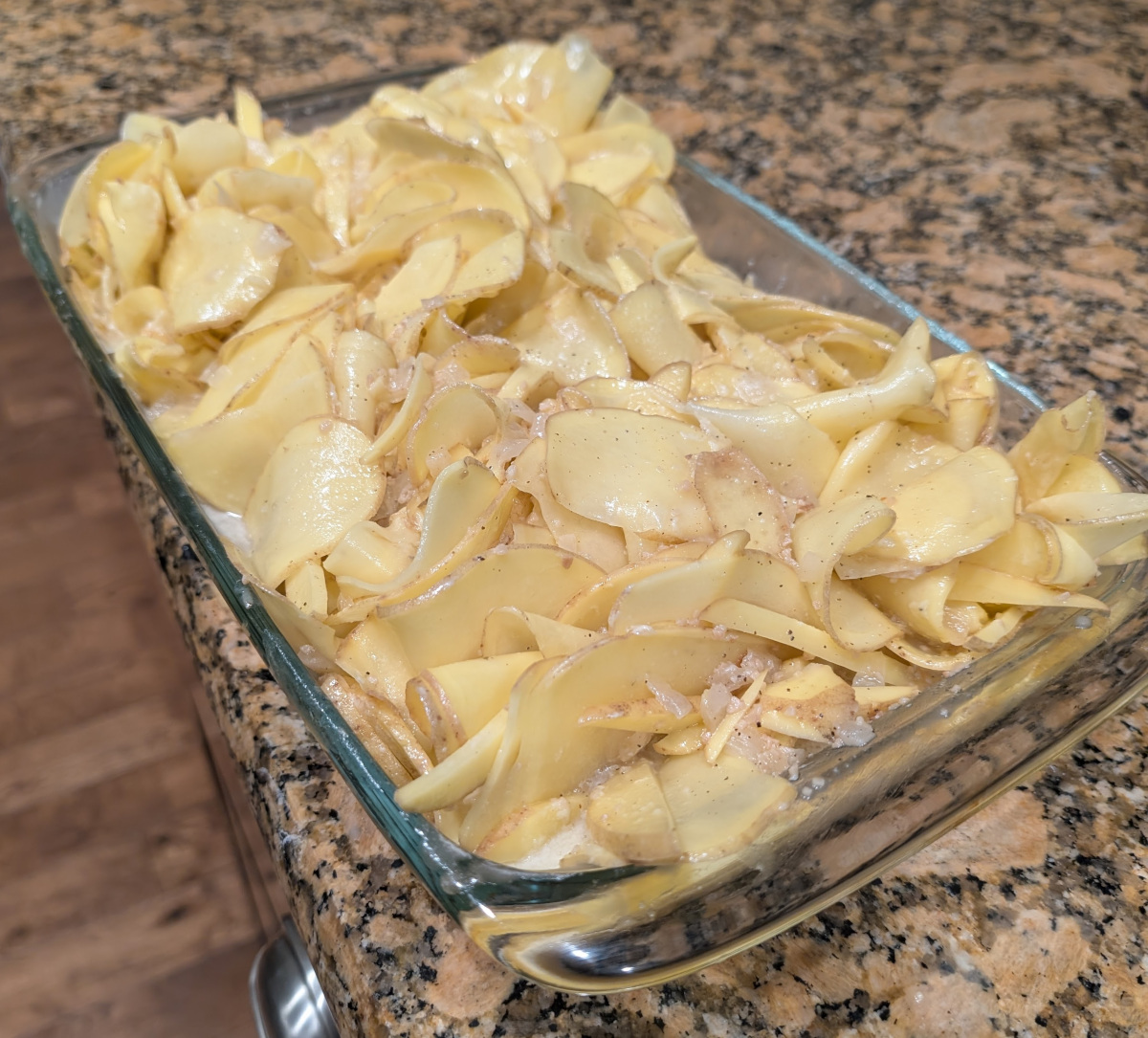 Potato and butter mixture haphazardly filling a casserole dish